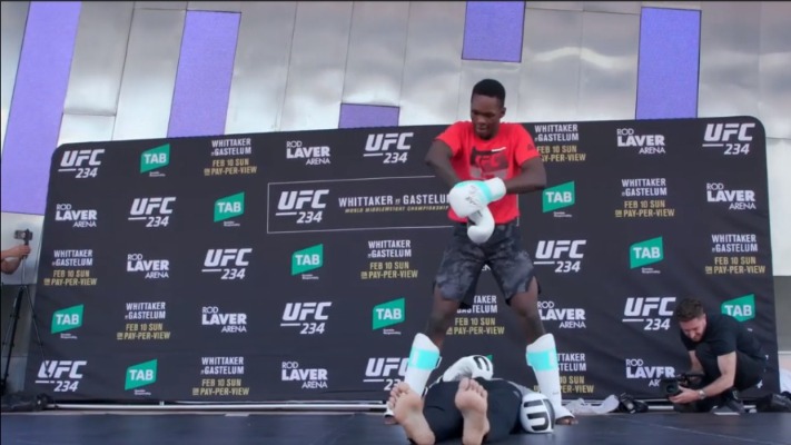 Israel Adesanya Performs Pro Wrestling Finishers During UFC 234 Open Workout