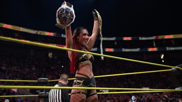 Jacy Jayne holds both NXT and TNA Women's titles. Photo: WWE/TNA