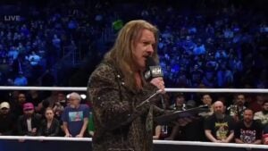 Chris Jericho posing in an AEW ring.