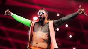 Jey Uso in YEET sunglasses with arms outstretched during his WWE entrance