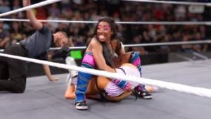 Chantel Monroe smiles as she pins Lizzy Rain while the referee counts on WWE NXT