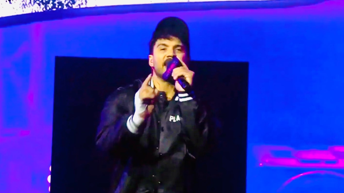 Max Caster rapping into a microphone during his TNA Bound for Glory entrance in Tampa
