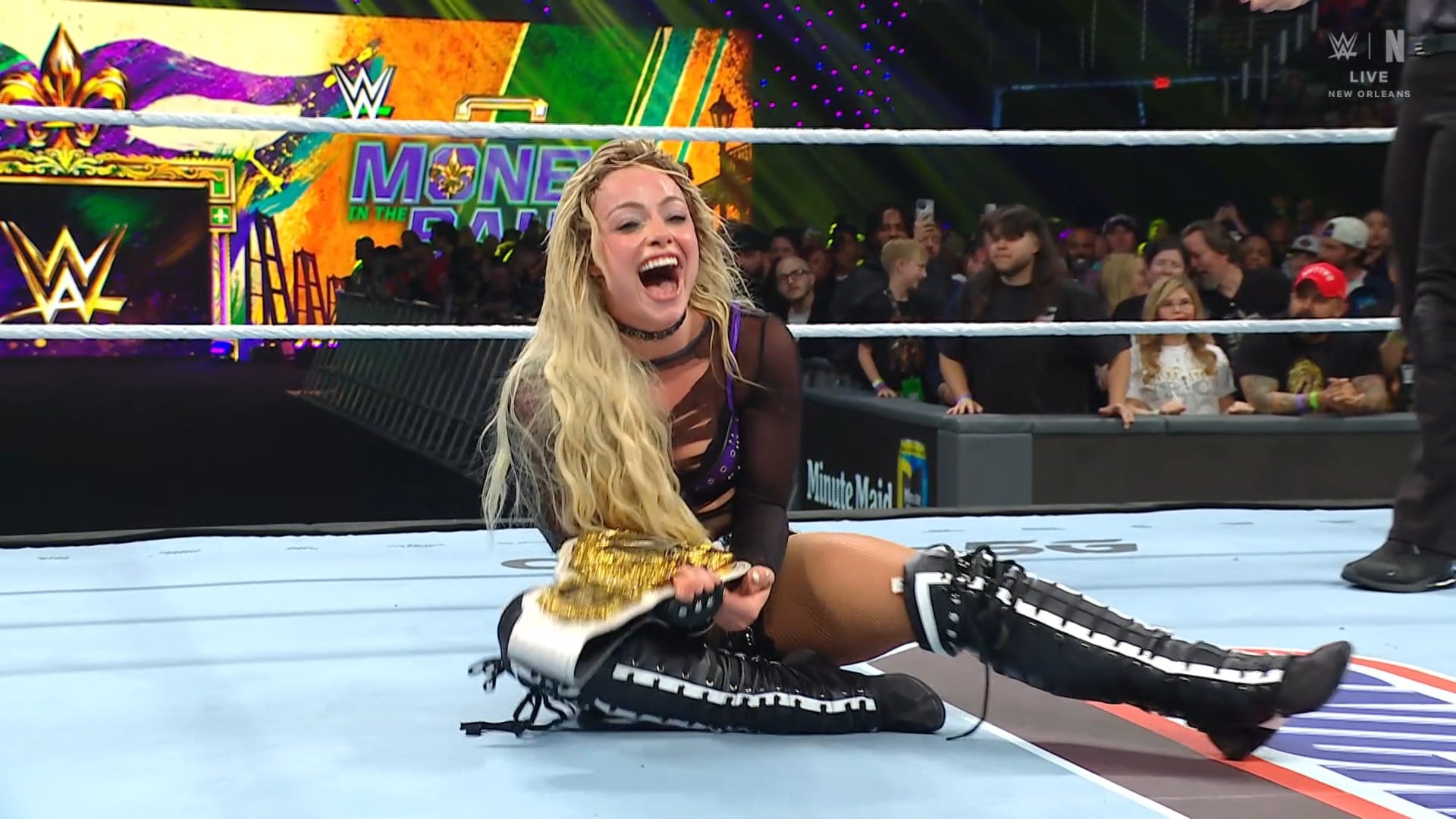 Liv Morgan celebrates winning the WWE Women's World Championship at Money in the Bank 2026