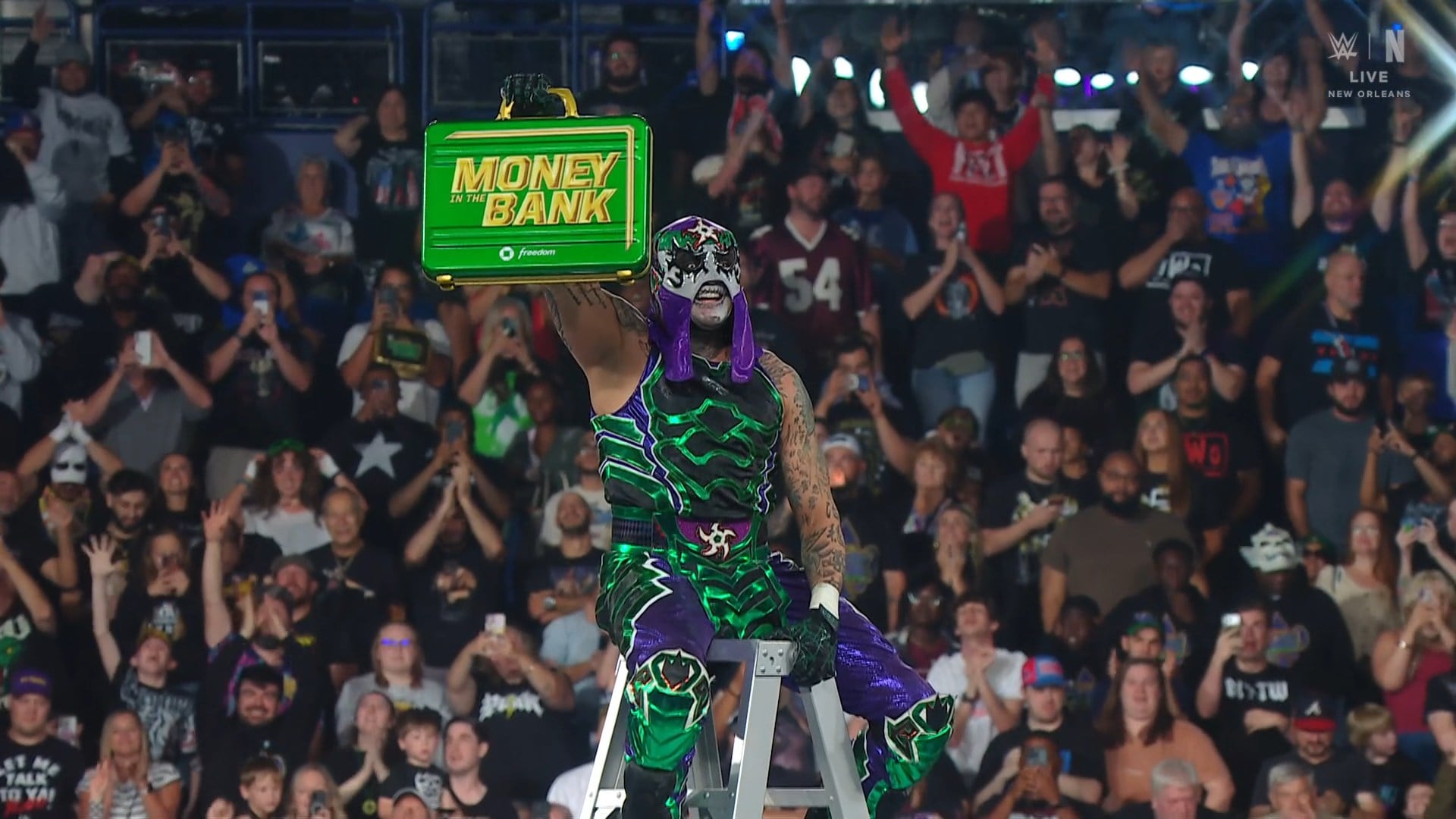 Penta holding the Money in the Bank briefcase after winning the 2026 men's ladder match in New Orleans