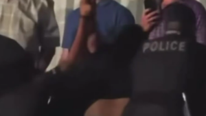 Fan Arrested For Throwing Drink At 946 On RAW