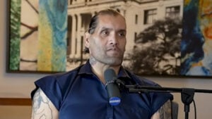 The Great Khali speaking into a microphone during a podcast interview
