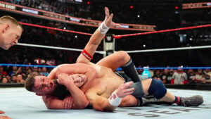 Gunther locks John Cena in a sleeper hold during Cena's WWE retirement match