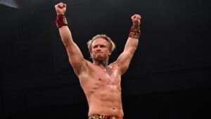 Ilja Dragunov raises his hands in victory after his AEW in-ring debut on Dynamite