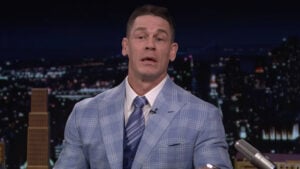 John Cena in a light blue plaid suit speaking on The Tonight Show Starring Jimmy Fallon
