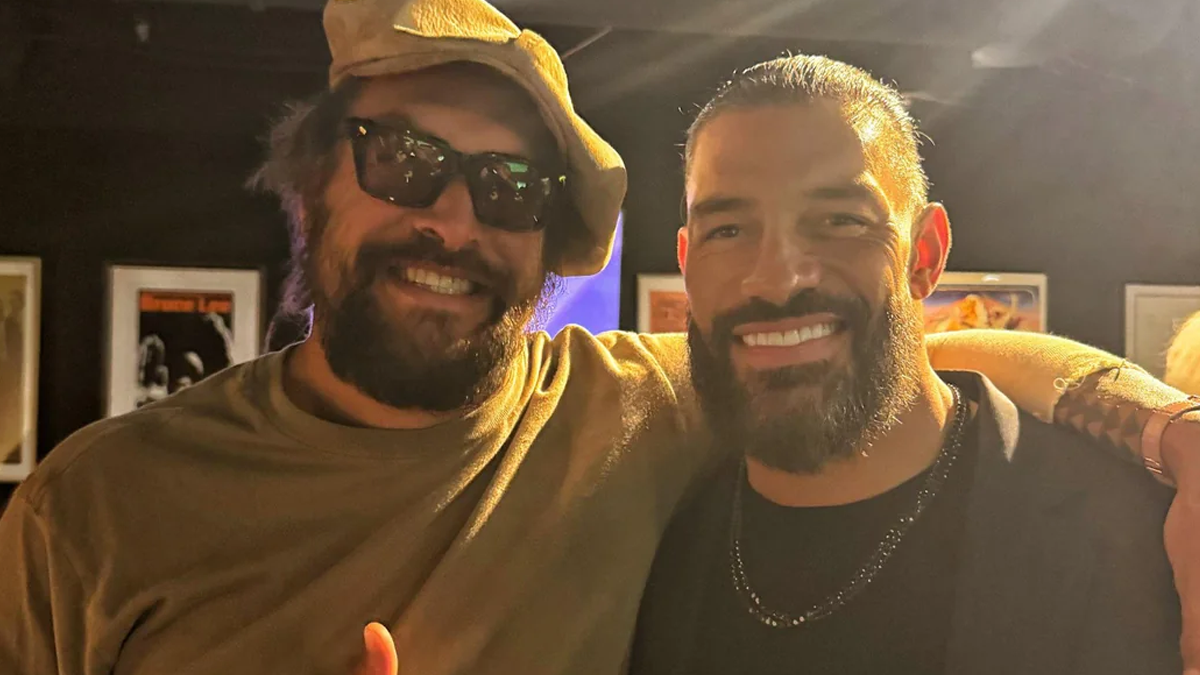 Jason Momoa and Roman Reigns smiling together in a photo