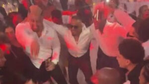 Solo Sikoa and Carmelo Hayes dancing with guests at Carmelo Hayes and Kelani Jordan's wedding